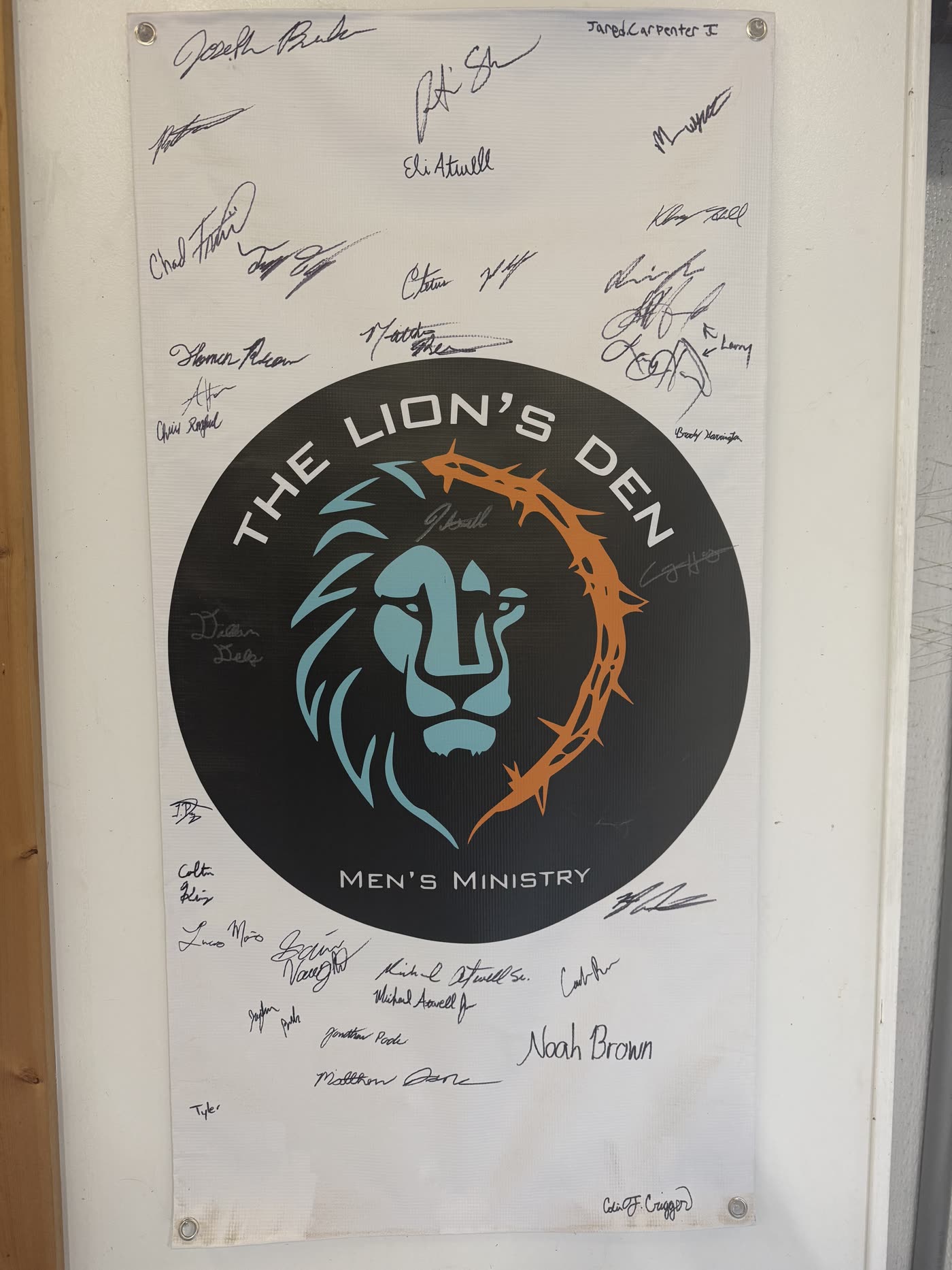 The Lion's Den banner, signed by every member
